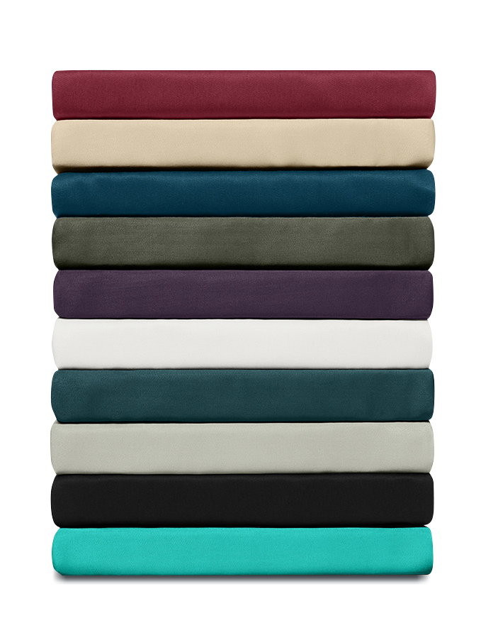 Stack of folded bed sheets in a variety of colors, neatly arranged to showcase color options and fabric quality.