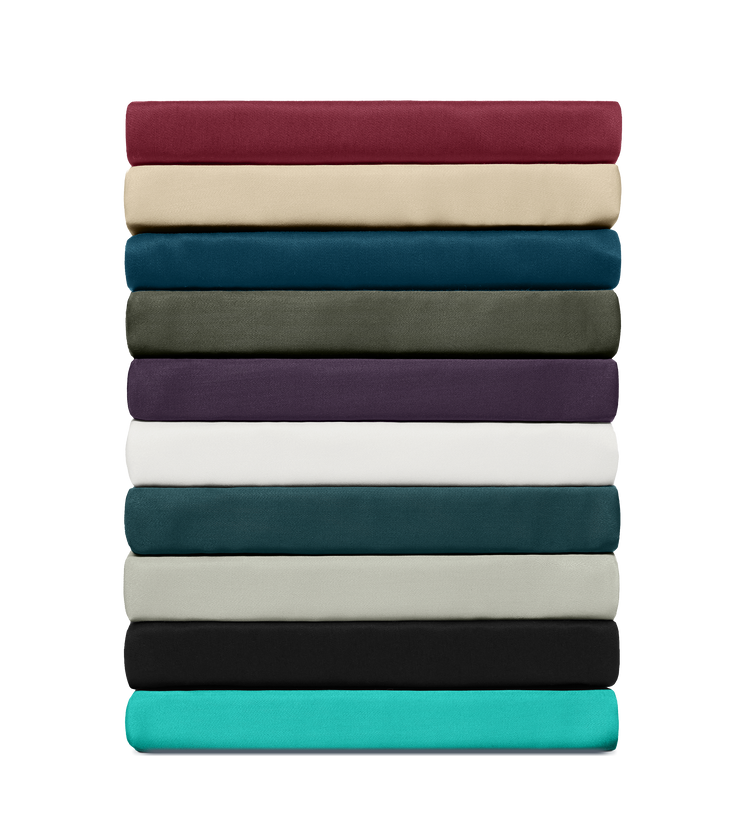 Stack of bamboo bed sheets in 12 colors, neatly folded on a transparent background.