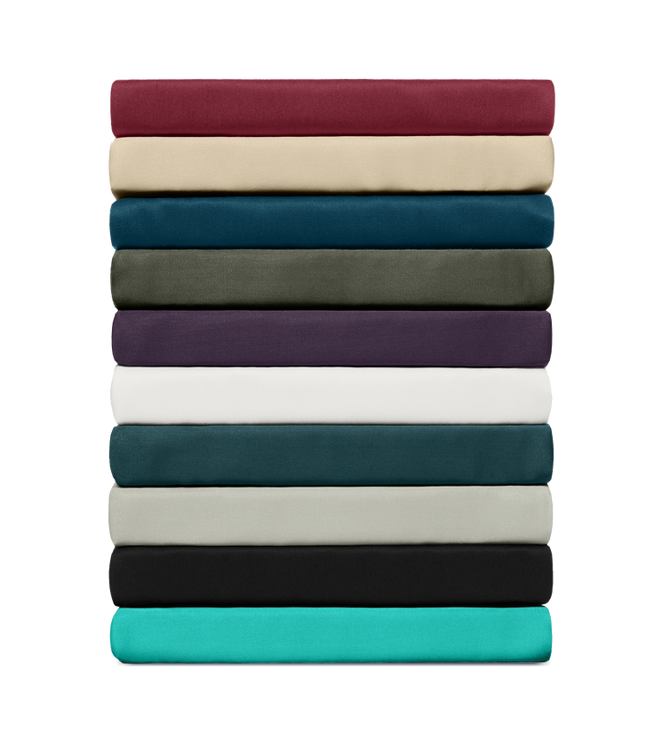 Stack of folded fabric sheets in various colors on a white background