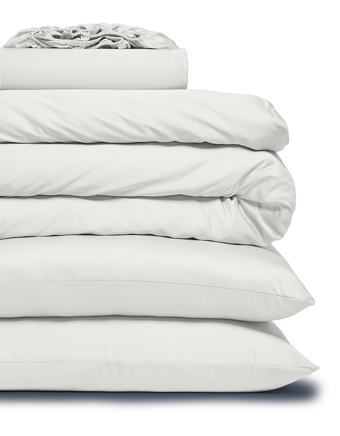 Stack of white bedding on a white background